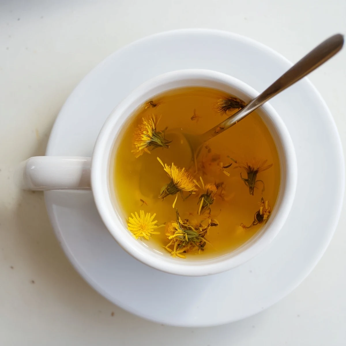 Clear glass mug displaying earthy dandelion tea infusion garnished with lemon slice and honey drizzle