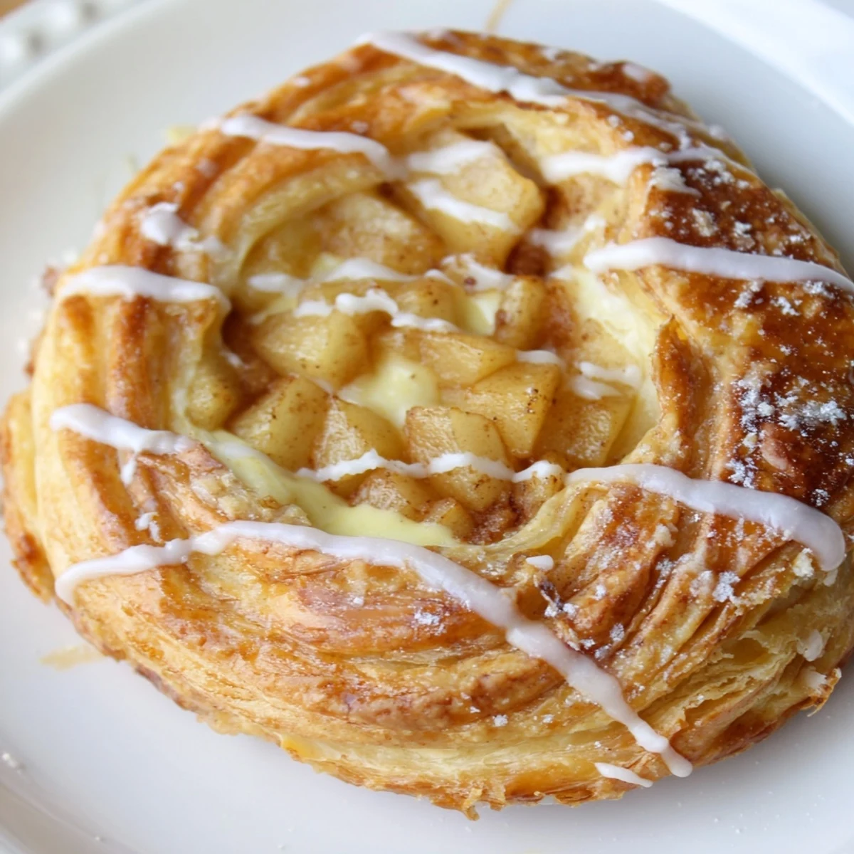 Creamy cheese and spiced apple topping these warm, golden brown Apple Cheese Danishes